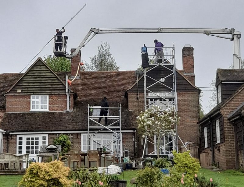 The Moss Cleaners using cherry picker and scaffolding to clean roof safely and professionally in Shipston-on-Stour, Warwickshire
